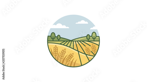 Harvested wheat field with green trees.