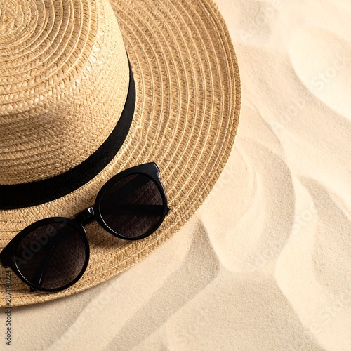 Trendy summer fashion layout featuring a pair of dark stylish sunglasses