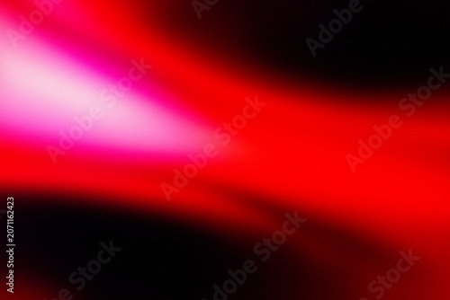 Картината върху платно Vibrant red glow pulses across dark background