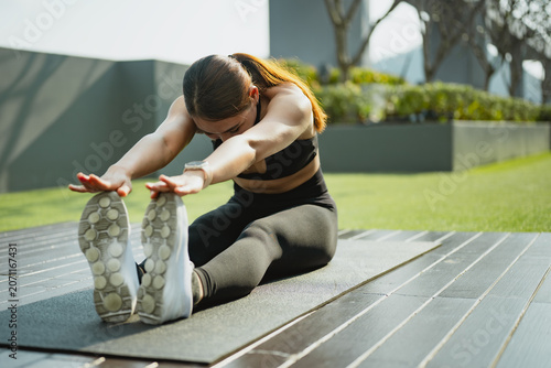 Bild auf Leinwand stretching fitness flexibility exercise workout Active woman performing seated f