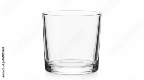 A transparent glass tumbler, meticulously crafted with smooth curves and a sturdy base, stands ready to hold refreshing beverages, offering a pure and unadulterated vessel for liquid enjoyment
