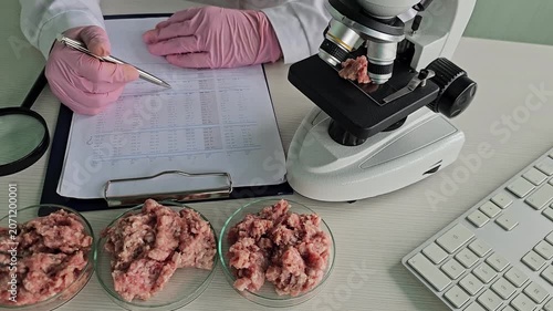 Microscope analysis of meat samples in laboratory setting during working hours