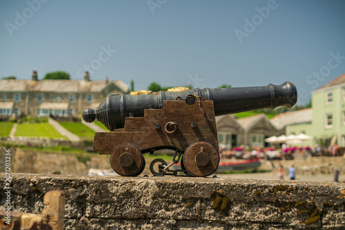 фотографія Historic Cannon Displayed on Stone Wall in Charlestown Harbour United Kingdom