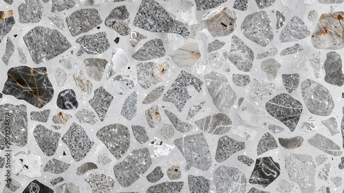 Light stone terrazzo surface with mixed fragments forming neutral textured background