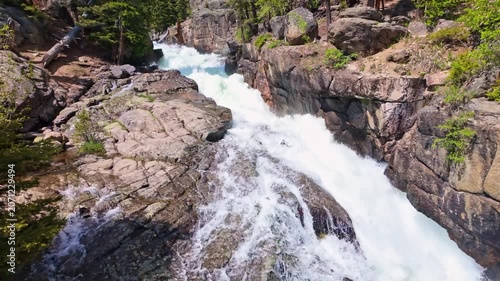 Lake Creek mountain river flows harshly through rocky terrain along the Beartooth Highway in Wyoming