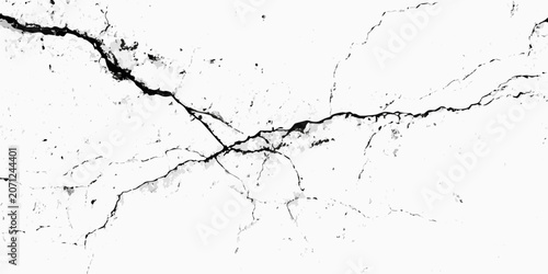 Foto Cracked surface texture with a white background featuring irregular fissures and