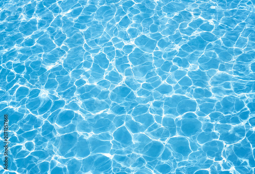Bild auf Leinwand Sunlight reflections on turquoise swimming pool water surface with turquoise ref