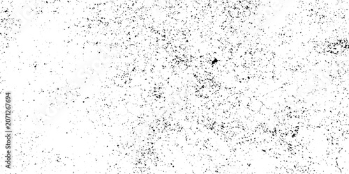 Cuadro en lienzo A close-up texture of gritty concrete surface, showing rough, uneven pattern with dark speckles against a bright white background