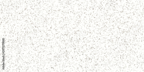 Фотография A granular texture of white and light gray particles creates an abstract pattern, suggesting a subtly detailed surface or an artistic representation of fine grit