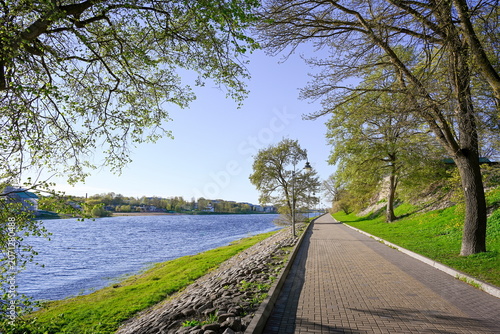 Quiet summer evening on the embankment of the Velikaya River in Pskov, Pskov region of Russia
