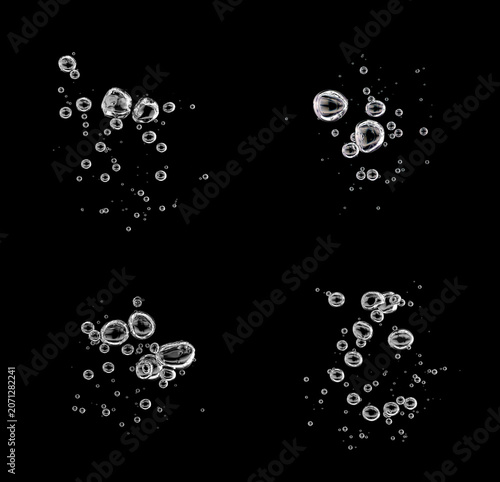 set bubbles rising to the water's surface isolated on a black background. drop air in water flowing up, underwater, clear liquid. water bubble white oxygen air