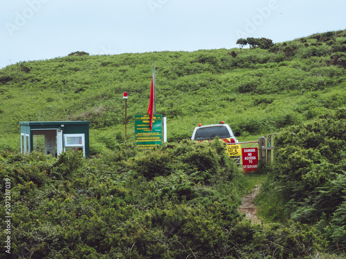 Принти на полотні Red flag on Pembrokeshire Coastal path, Wales - access restricted for military t