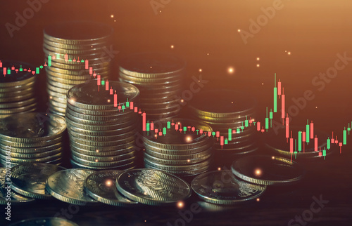 Bearish financial market concept with declining candlestick chart and stacked coins. Represents investment risk, economic slowdown, market correction, volatility and trading uncertainty.