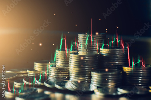 Financial analysis concept with stacked coins and trading indicators. Ideal for investment research, stock market insights, portfolio evaluation, economic forecasting and business strategy.