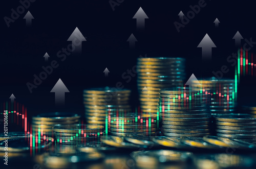 Stacked coins with upward arrows and trading chart symbolize financial performance, business growth, investment success, increasing revenue, market expansion and profitability trends.