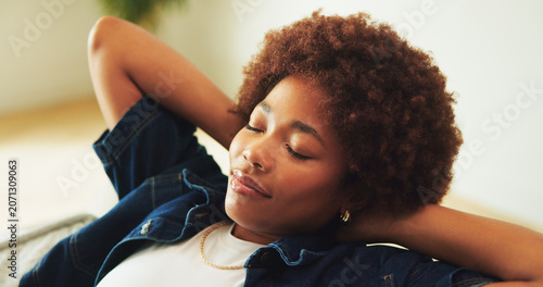 Photos Black woman, stretching and sleep on sofa with peace, calm and chill with wellness on weekend break