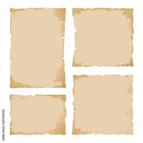 Set of four different sizes of antique parchment paper sheets with scalloped borders and stained textures isolated on grey background.