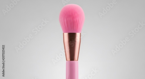 Professional pink makeup brush tool isolated on soft minimalist studio background clean view