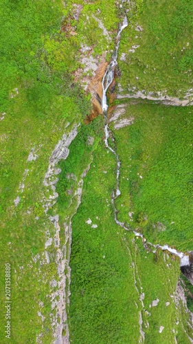 Shaghot Waterfall, Tall Mountain Waterfall Cascading Through Rocky Alpine Gorge 