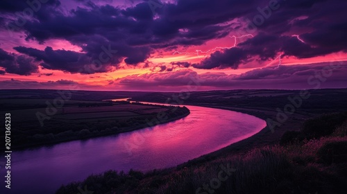 Breathtaking sunset over a winding river, with vibrant purple and pink hues illuminating the sky and reflecting on the water surface.