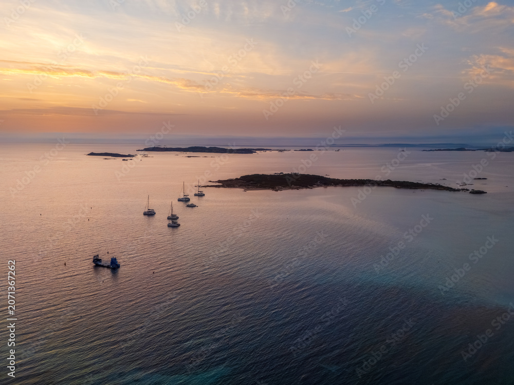 Fototapeta premium Aerial view sailboats anchoring near Corsica coastline