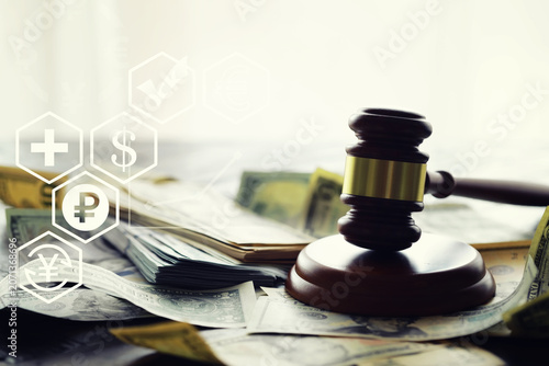 Judge gavel On Dollar Cash. Corruption, Bankruptcy Court, Crime, Bribing, Fraud, Auction Bidding concept.
