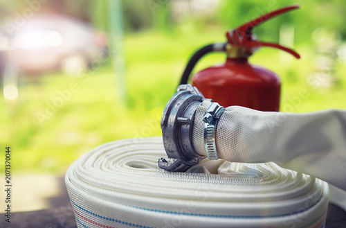 Fire extinguisher has hand engineer inspection checking pressure gauges to prepare fire equipment for protection and prevent emergency and safety rescue and alarm system training concept.