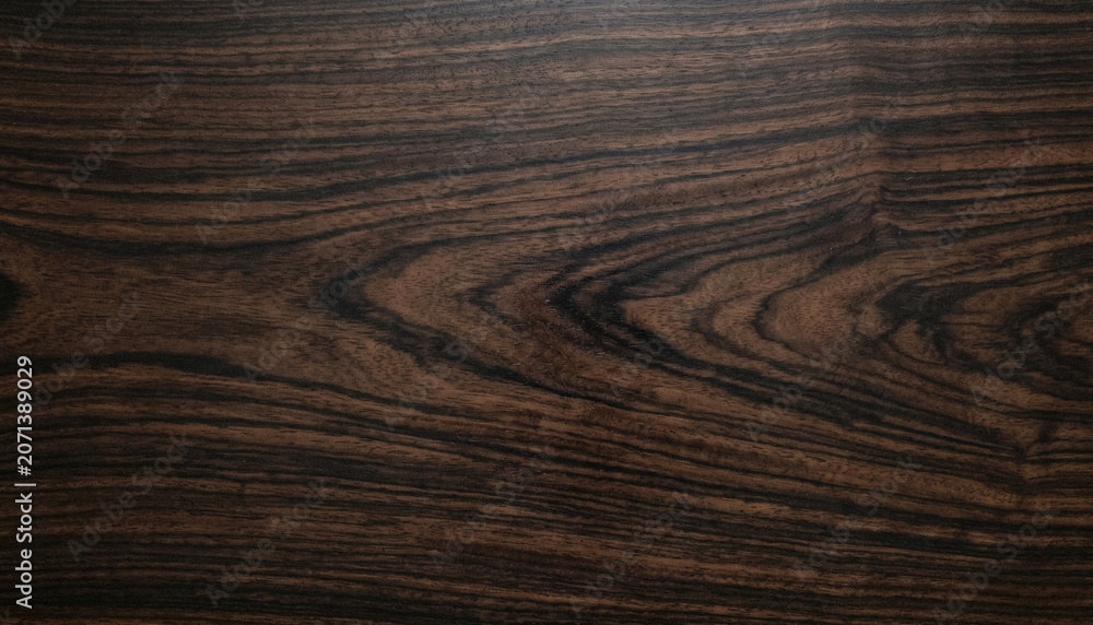 Fototapeta premium Full frame timber texture showcasing mesmerizing grain waves and natural wood character. Rich contrast and detailed patterns create a refined rustic backdrop.