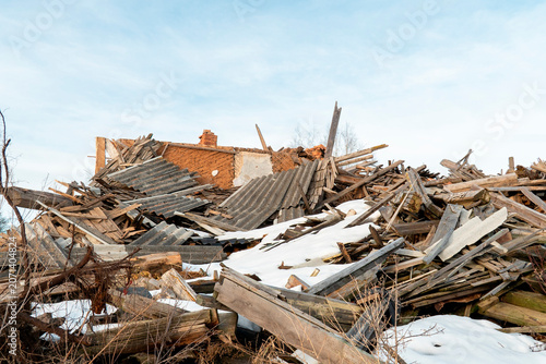 Bilde på lerret Old building collapses in winter, leaving rubble and debris scattered across the