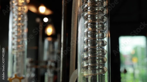 Distillation glass spiral alcohol gin laboratory equipment transparent industrial closeup science create modern scientific atmosphere with distillation column glass coil laboratory equipment alcohol