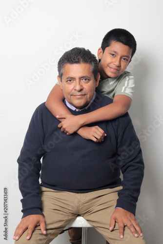 Latino single dad and his 12-year-old Latino son show their love to celebrate Father's Day