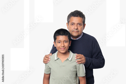 Latino single dad and his 12-year-old Latino son show their love to celebrate Father's Day