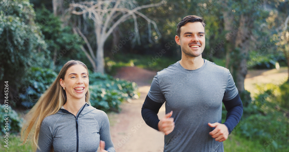 Fototapeta premium Fitness, happy or couple in nature with running, exercise together or bonding in physical activity. Smile, athletes or people on path with jog, cardio training or workout connection in active hobby.
