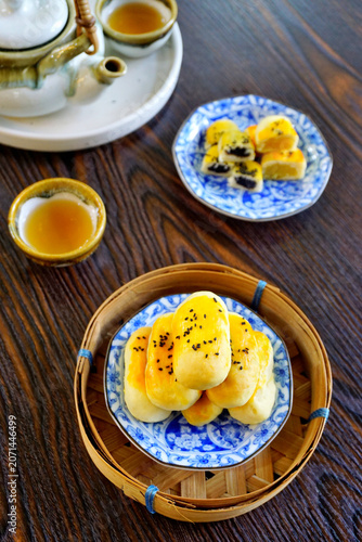Chinese pastry in blue dish on wooden table