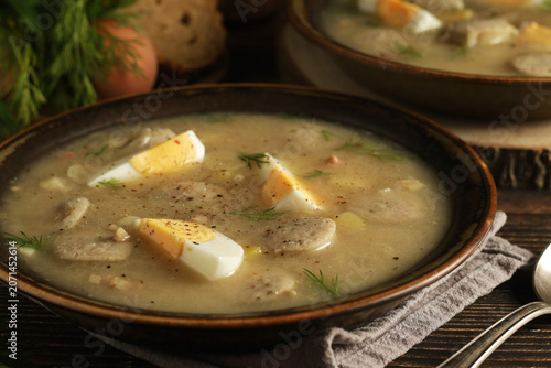 A plate with soup Zurek - traditional dish of Poland	