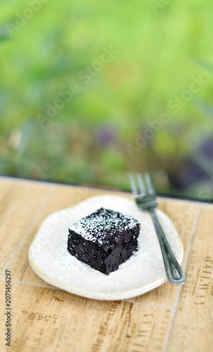 Brownies on a table in the garden, Soft focus
