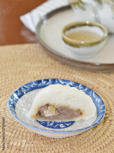 Chinese bun with a bite mark