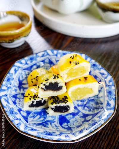 Sliced Chinese pastry in blue dish, Vintage dessert