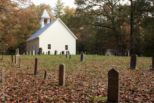 Primitive Baptist Church with an old graveyard on an autumn morning in Cades Cove, Great Smoky Mountains National Park, Tennessee