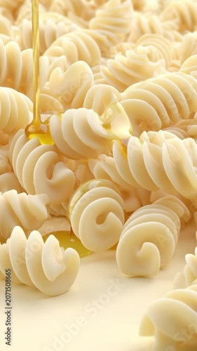Fusilli pasta spiral shape uncooked close up with golden oil drizzling, glossy texture, appetizing Italian cuisine, raw ingredient macro food photography, soft yellow background, food texture