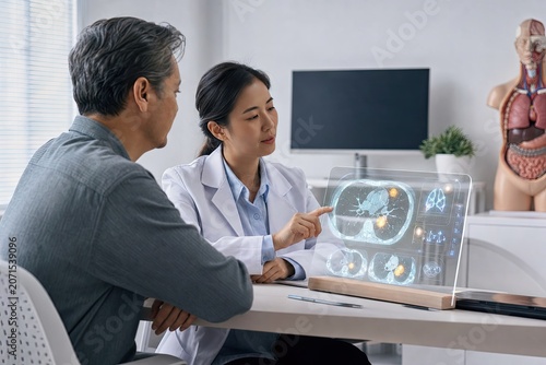Doctor Explaining Digital Scan Results To Patient