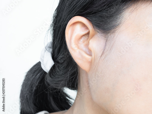 Billede på lærred Ear, close up ear woman she listenign, body part for presentation product medica