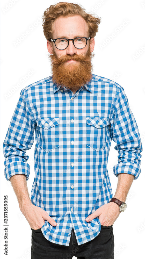 Fototapeta premium A bearded man in glasses and a checkered shirt stands against a white background, embodying casual style and confidence.
