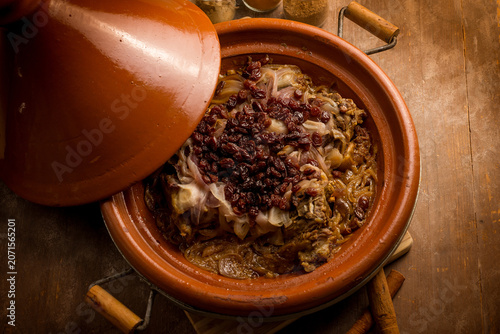 traditional moroccan lamb tajine with onions and dried grapes