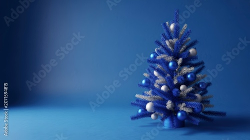 Chic Miniature Christmas Tree Adorned with Sparkling Blue and Silver Baubles on a Vibrant Monochromatic Blue Setting