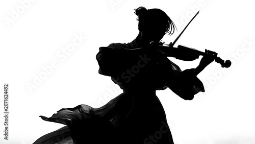 Black silhouette of a horse rearing up dramatically against sky.