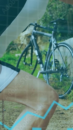 Vertical video: AR popping as cyclist pedaling and bracing arm on wall near bike, fitness charting