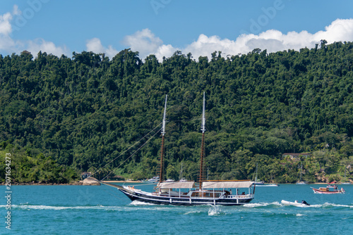 Tourist schooner traffic visiting the beaches and islands of Paraty. Paraty, Rio de Janeiro, Brazil.
