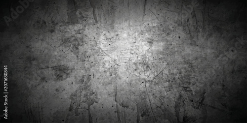 Bild auf Leinwand A textured, dark grey concrete wall with visible scratches and imperfections, creating a rugged and industrial backdrop