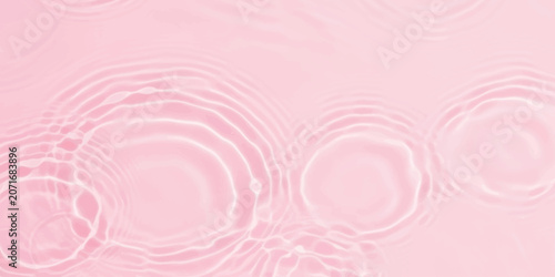 Fotografía Pink water ripples on a liquid surface background